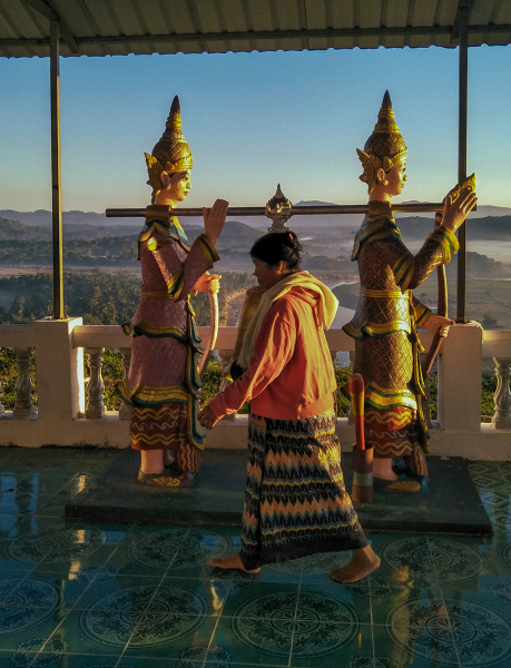 Woman walking through a pagoda